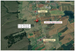 Der Mittelpunkt liegt auerhalb des Ortes auf einem Feld
